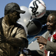 Minnie Minoso with a statue of himself before White Sox game in 2004.